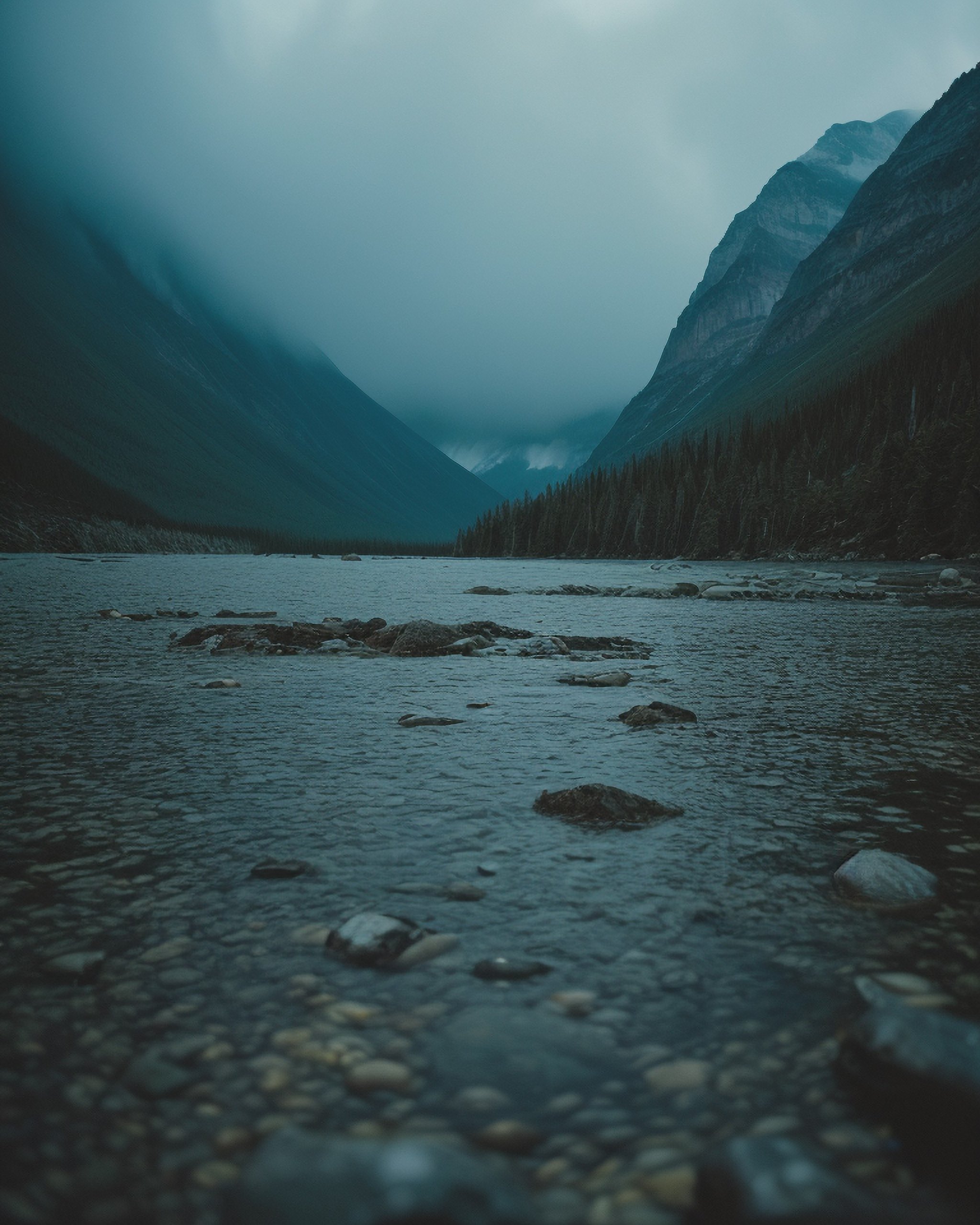 (Jasper mountains, fryatt valley), Full 4D, Storm, rain, rain on lens Rain drops hitting water, real water movement Sharp picture details, Shallow depth of field, (Full depth of background), Intricate microscopic details.....Dark, Volumetric cinematic lighting<lora:epi_noiseoffset2:0.25>. >Cinematic Masterpiece, Mirrorless Kodak Motion Picture Film Style <lora:Kodak Motion Picture Film:0.25>. Ambient light, Bloom, Canon EOS R6, Nokton 70mm f1.1, [Strong shapes composition], Cinestill 800T, Vignette, award winning quality