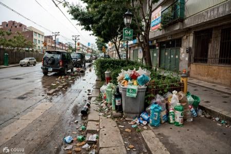 RAW photo,subject,8k uhd,dslr,soft lighting,high quality,film grain,Fujifilm XT3,,ruanyi0042,no humans,bottle,box,bucket,building,cardboard box,cup,fence,food,lamppost,paper bag,plant,plastic bag,power lines,road,rubble,ruins,soda can,street,traffic light,trash bag,tree,window,,<lora:0042 garbage city_v2:1>,<lora:detail_slider_v4:1>