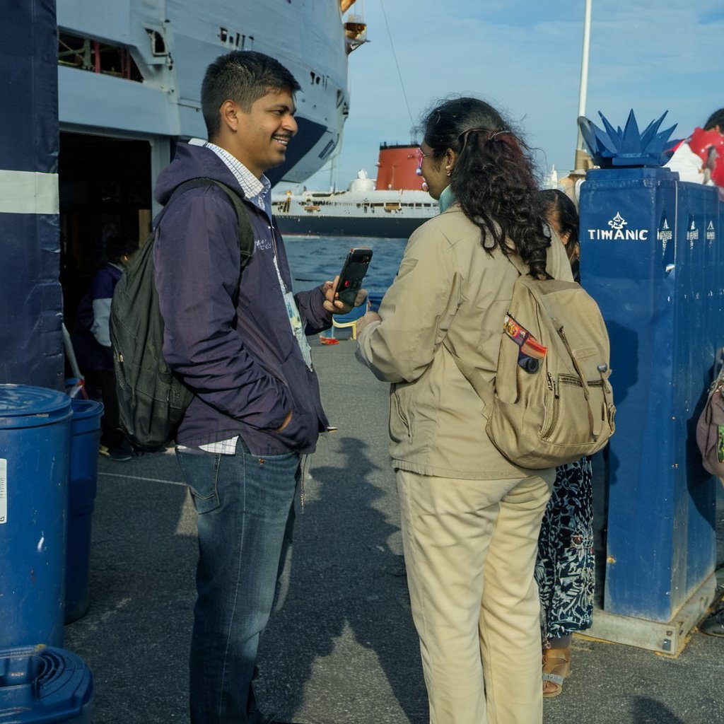 phone photo of a smiling 28 year old Indian woman with long hair posing on the titanic. <lora:boring-v4:0.5><lora:boring-alpha-v3:0.4> <lora:boring-v4-faces-version:0.4>