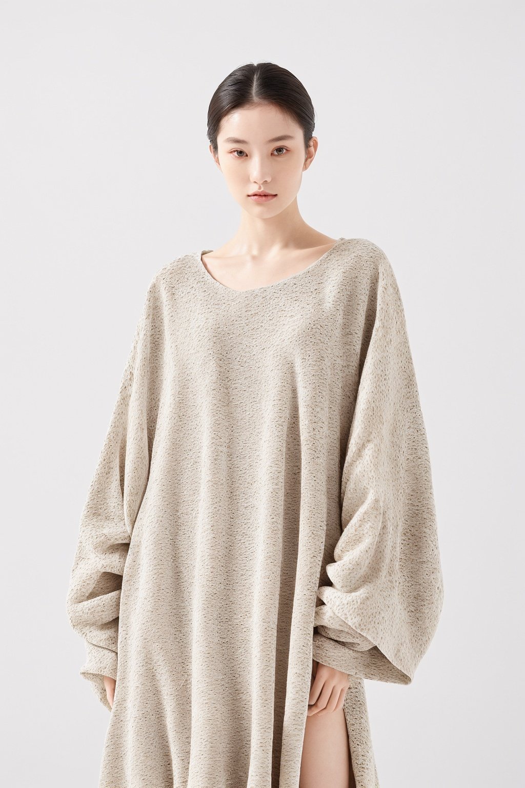 (a portrait of a woman:1.2), ([large clothes : marble texture]:1.4), (low contract:1.1), realism, professional photo, studio shot, modern fashion, (simple background:1.3), detailed, (minimalism:1.1)
