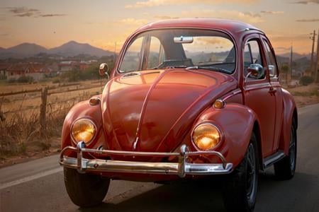 analog gloomy photo of a (dark red) Volkswagen Beetle car, <lora:vwb33tl3:1>, ((three quarter view)), (dark sunset), driving on a dirt road, (dilapidated town), 1969, ((horror movie)), slasher film, texas chainsaw massacre, amish cult, film grain, retro,  High Detail, Sharp focus, ((photorealism)), realistic, best quality, 8k, award winning, dramatic lighting, epic, cinematic, masterpiece