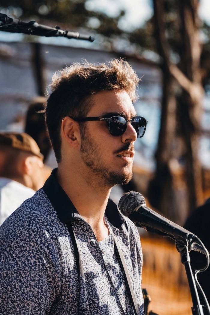 photo of a man, Australian, unibrow, depth of field, musician