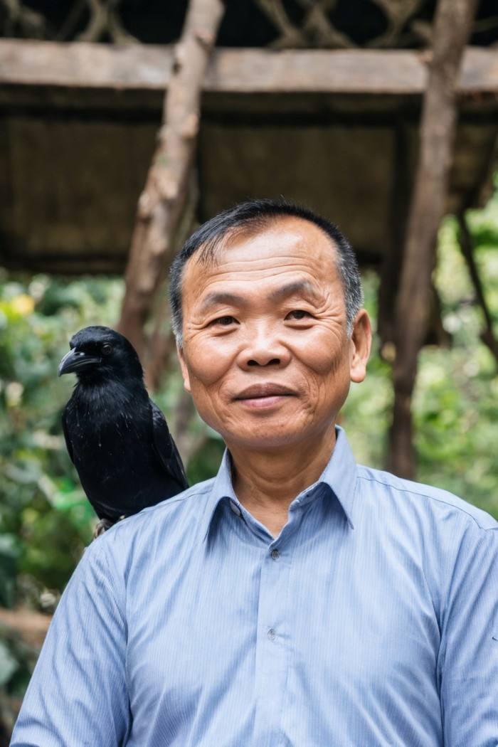 photo of a man, Vietnamese, middle-aged with crow's feet, architect