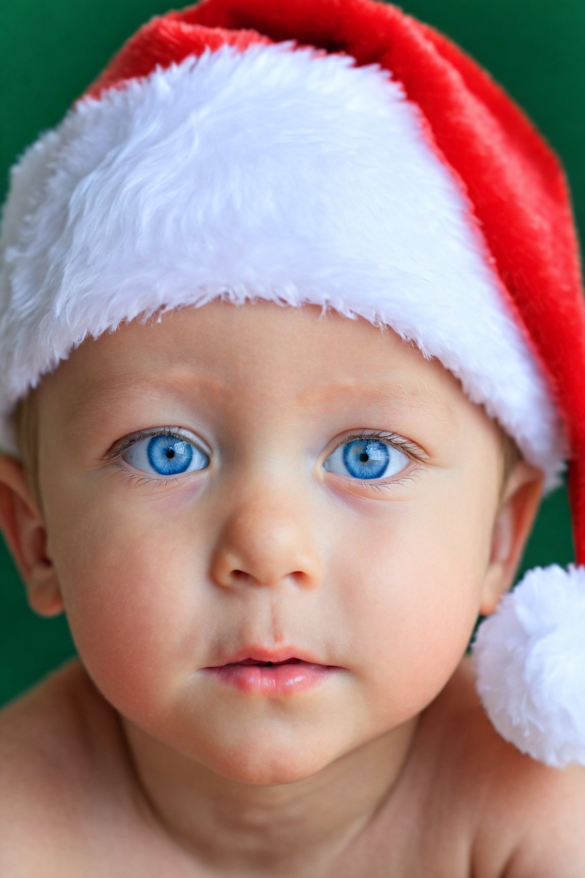 Christmas solo,  looking at viewer,  blue eyes,  1boy,  hat,  male focus,  blurry,  depth of field,  christmas,  santa hat,  realistic,  male child,<lora:EMS-187840-EMS:0.800000>