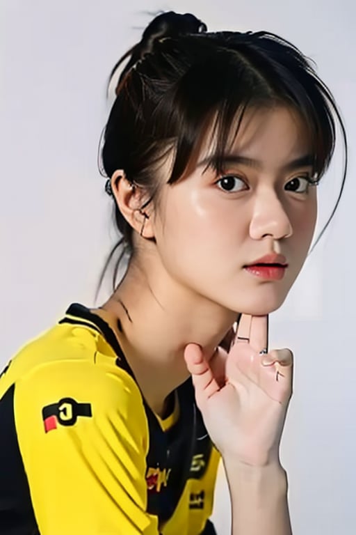 portrait of a beautiful 18 year old girl, wearing a yellow jersey, white background, picture taken using a 150 mm Canon lens