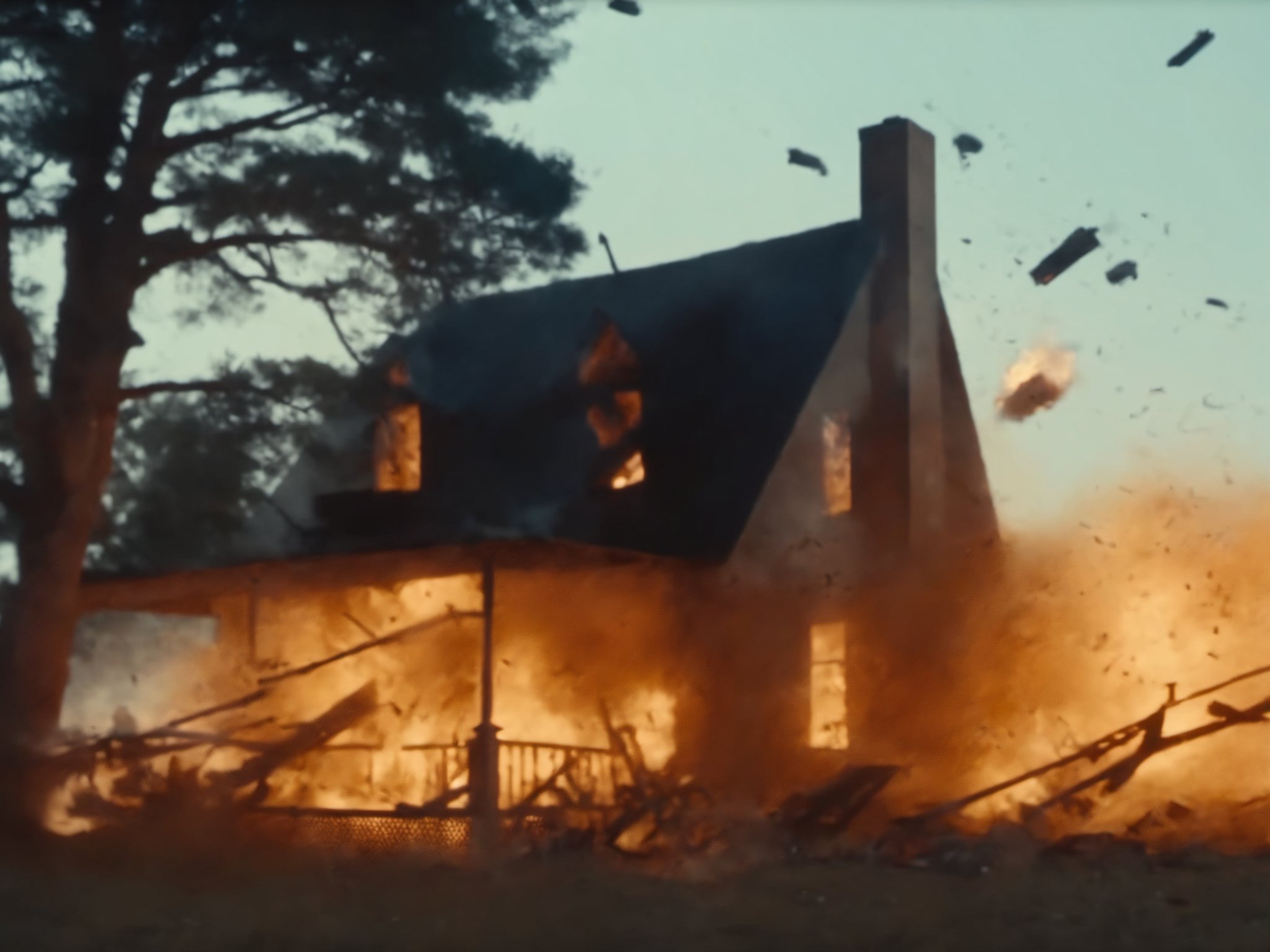(m0vieexpl0sion), film still of a house, far view, (small explosion:0.7), trees, sky, flying debris, best picture, best quality, UHD, oscar winner