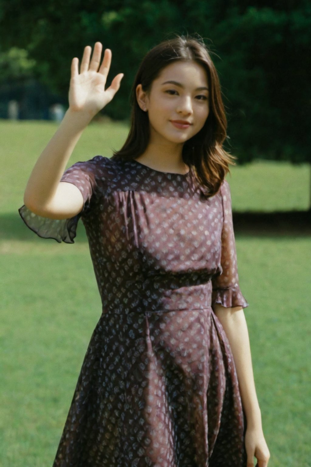 young woman wearing a flared dress, waving at the viewer