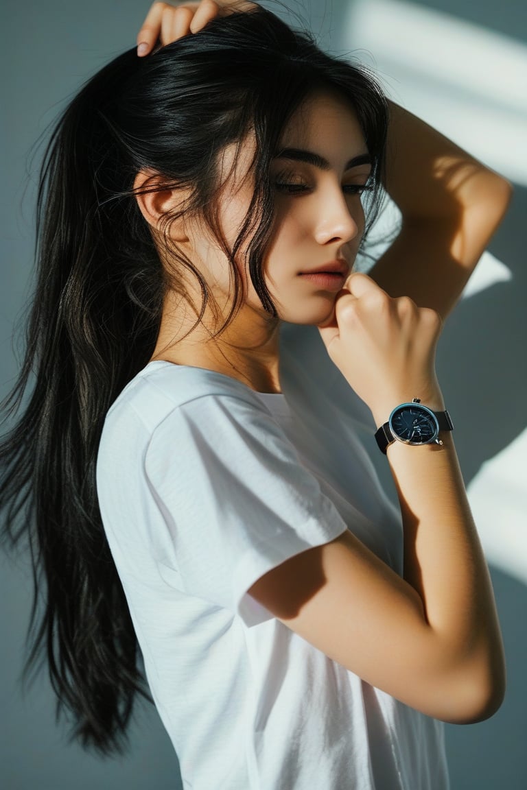 Photography, a girl with long black hair and brown eyes is captured in a dynamic pose, focusing on her upper body. She is wearing a white t-shirt with short sleeves, with her hair partially covering one eye. Her arms are raised as she looks to the side, adjusting her hair into a ponytail. she is holding hair tie, and a wristwatch is visible on her arm. A shadow falls behind her as she concentrates on tying her hair