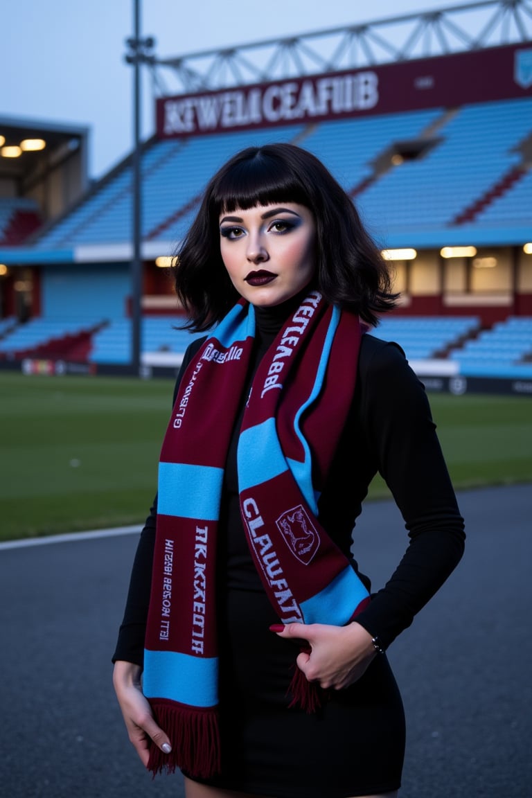 A stunning woman with dark hair and striking goth makeup is standing outside Villa Park, the home of Aston Villa Football Club. She is wearing a claret and blue football scarf that contrasts with her edgy appearance. The scene captures her in a bold and confident pose, with the iconic Villa Park stadium as the backdrop. The lighting is moody, enhancing the dramatic effect of her goth style against the vibrant colors of the scarf and stadium.