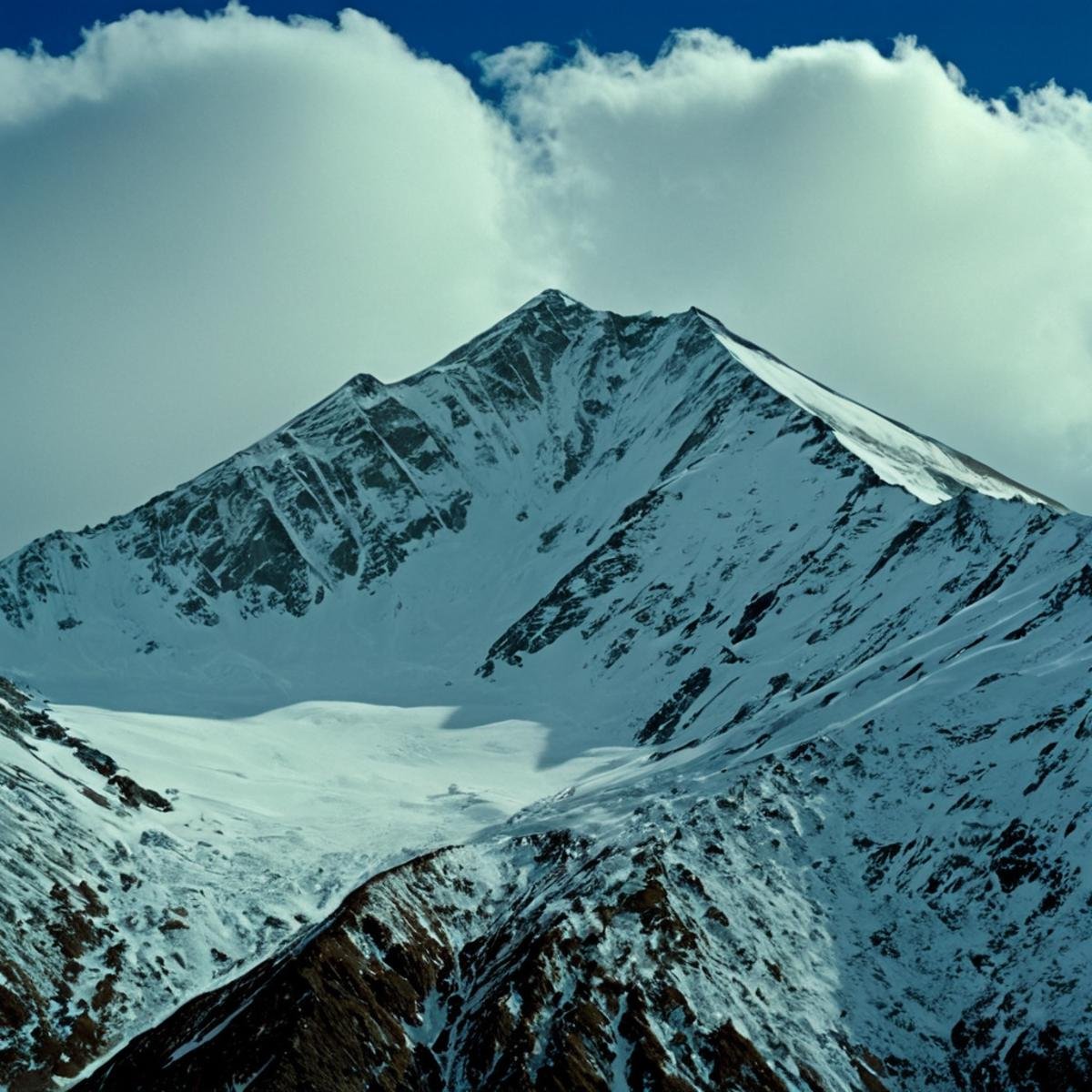 UHD, 4k, ultra detailed, cinematic, a photograph of  <lora:Ron Fricke style v2:1>a mountain range with a snow covered mountain in the background, outdoors, sky, day, blue sky, no humans, scenery, snow, mountain, landscape, mountainous horizon, realistic, realism, movie still, film grain, kodak film, film contrast, film color, cinematography, documentary, photography, 70 mm film, 65 mm film, Todd-AO, Todd-AO 35, 8K resolution, Ron Fricke film director style, Ron Fricke film directing style, Ron Fricke style, cloud, nature, epic, beautiful lighting, inpsiring