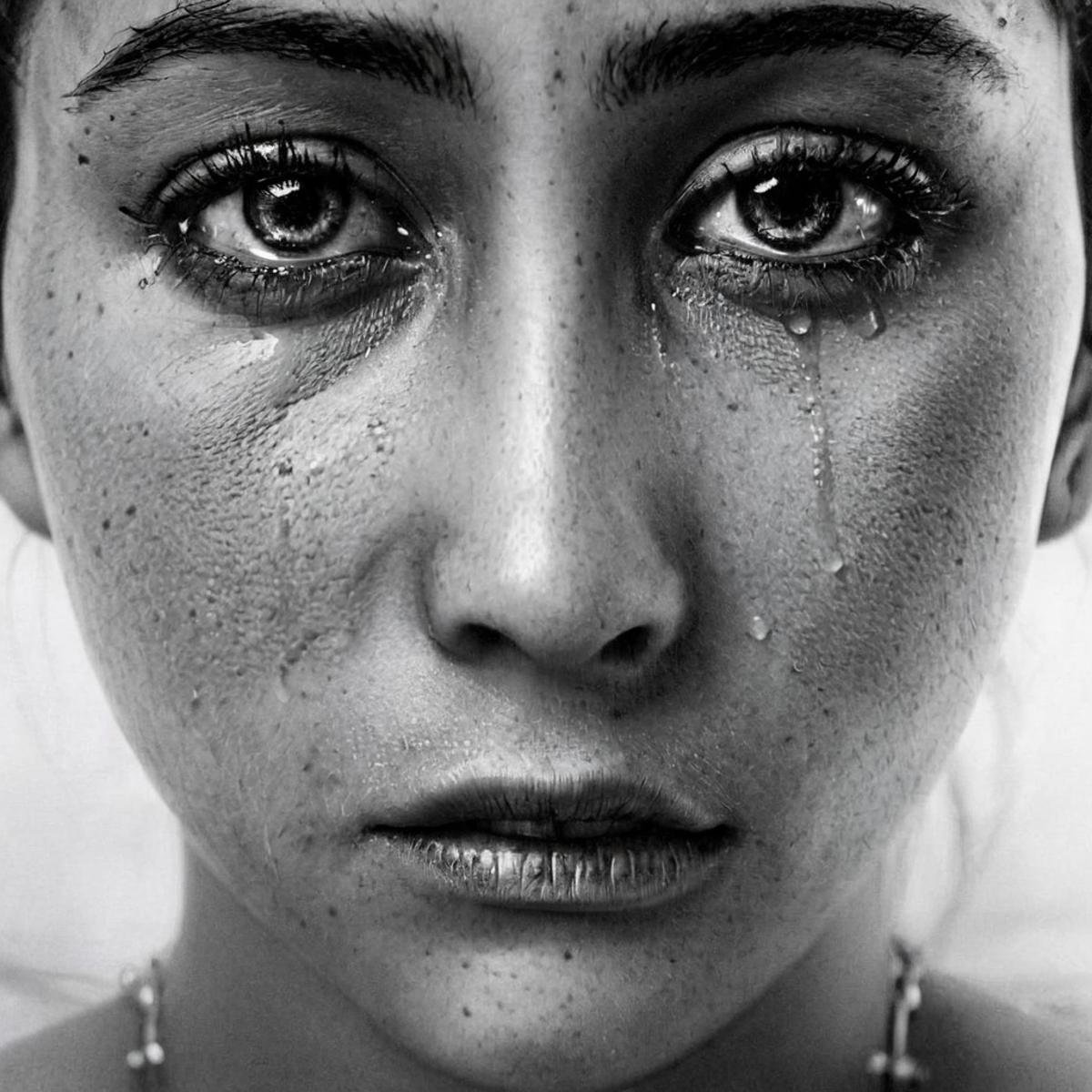 Hyperrealistic art of  <lora:crying style v3:1>a woman with tears on her face is crying.,solo,looking at viewer,simple background,1boy,monochrome,greyscale,male focus,portrait,freckles,realistic , crying, sad, teary face, tears, crying style, Extremely high-resolution details, photographic, realism pushed to extreme, fine texture, incredibly lifelike