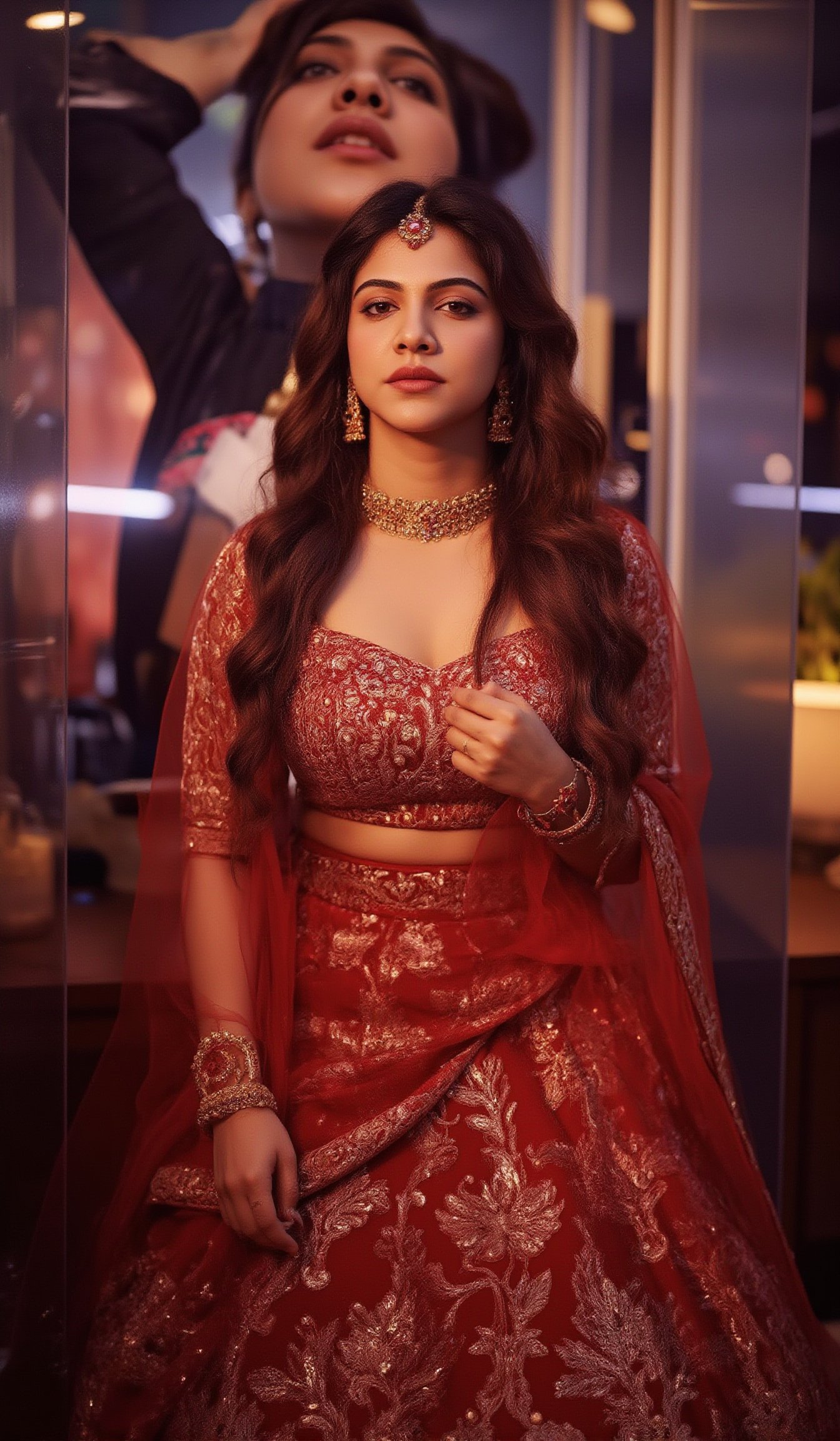 A stunning Madona Sebastian, dressed in a rich red lehenga with intricate embroidery, paired with heavy gold jewelry and a statement bindi on her forehead. Her long hair falls elegantly down her back as she strikes a confident pose, one hand resting on her hip and the other holding a delicate gold earring. The soft lighting highlights her natural complexion, while her eyes are enhanced by smoky eyeliner and volumizing mascara. She stands against a luxurious Bollywood-style backdrop, with subtle neon accents to emphasize her glamorous attire.,Madona Sebastian 