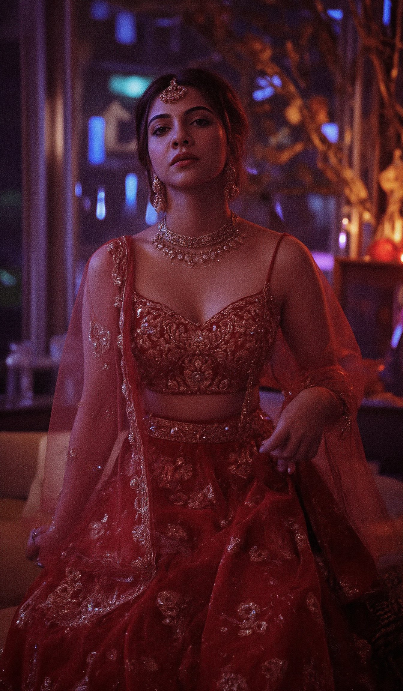 Cool cinematic lighting, matrix movie theam,A stunning Madona Sebastian, dressed in a rich red lehenga with intricate embroidery, paired with heavy gold jewelry and a resting on her hip and the other holding a delicate gold earring. The soft lighting highlights her natural complexion, while her eyes are enhanced by smoky eyeliner and volumizing mascara. She stands against a luxurious Bollywood-style backdrop, with subtle neon accents to emphasize her glamorous attire.,Madona Sebastian 