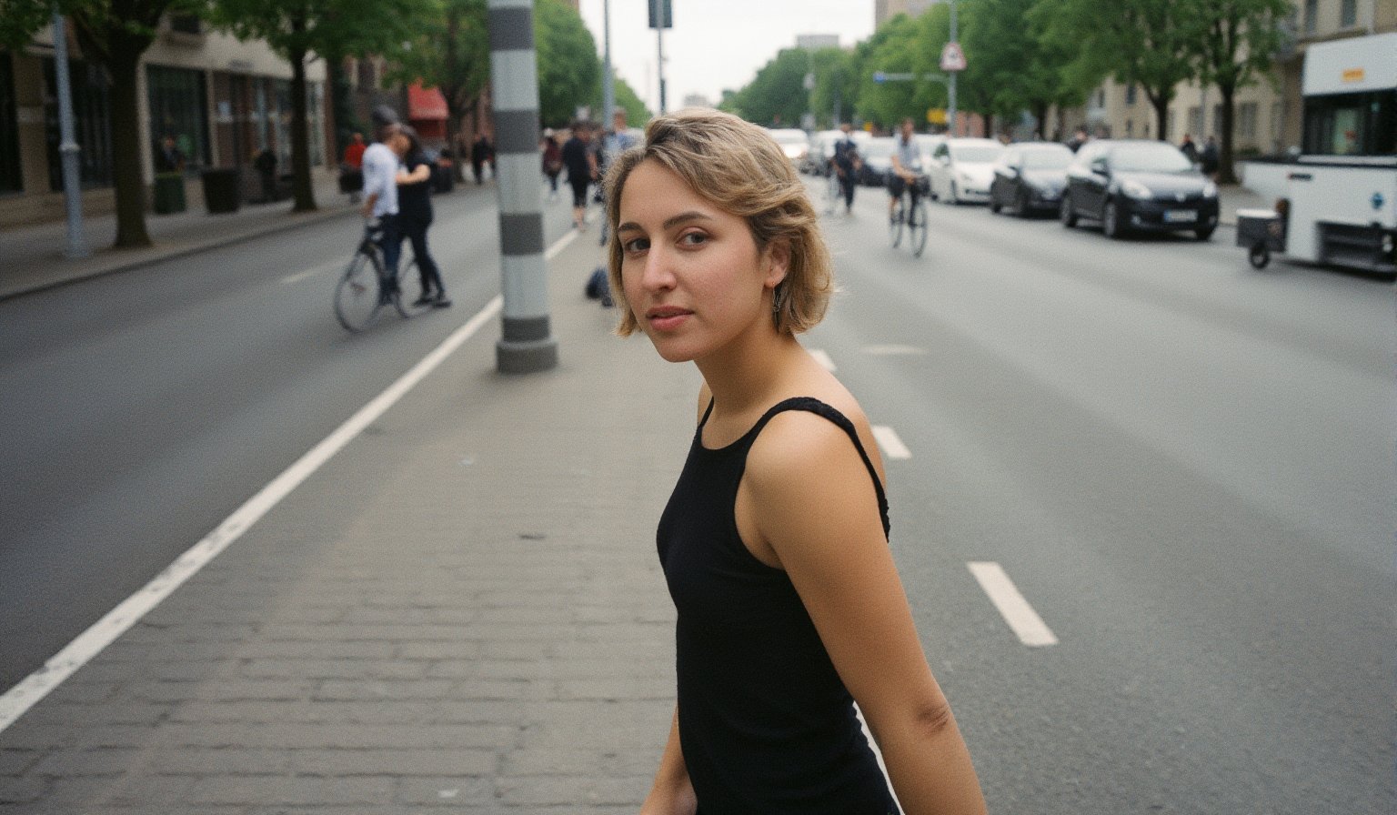 Wide view  Artsy lomo shot. Candid street photography by a art photographer, Chiaroscuro, capturing a spontaneous, unposed moment in a busy city. ((Wide shot)), ((rule of thirds composition)), the subject placed to the side, blending naturally into the urban scene. ((Full body)). A beautiful young woman in her twenties with soft, elegant features is walking through the street, totally ((unaware of the camera)), lost in her thoughts, looking away from viewer, going about her day without noticing anyone watching. Her skin shows natural imperfections with (((visible pores))), adding realism. Her striking blue-green eyes, framed by thick lashes, seem distant, and her defined cheekbones give her a graceful look. Her lips, naturally rosy, form a faint, relaxed smile. Blonde whii hair cascades in an uneven bobcut, flowing naturally around her face. She wears a sleek, stylish dress that compliments her figure, paired with minimal but refined jewelry, like small diamond earrings. In the background, a busy city scene unfolds with cars, pedestrians, and cyclists, capturing the essence of everyday life. The photograph embraces natural lighting, with rich colors, film grain, and kodachrome vibes, creating an authentic feel. The high depth of field ensures every detail is crisp, making it feel like a candid, fleeting moment frozen in time. Masterpiece-level, fine art street photography, focused on the anonymity and unawareness of the subject, caught in the moment.

. flfmt,flmft