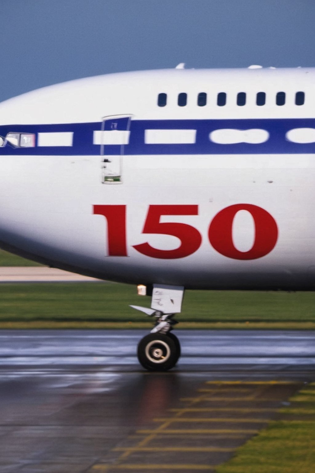 Flying passenger airplane with Text "150" Text