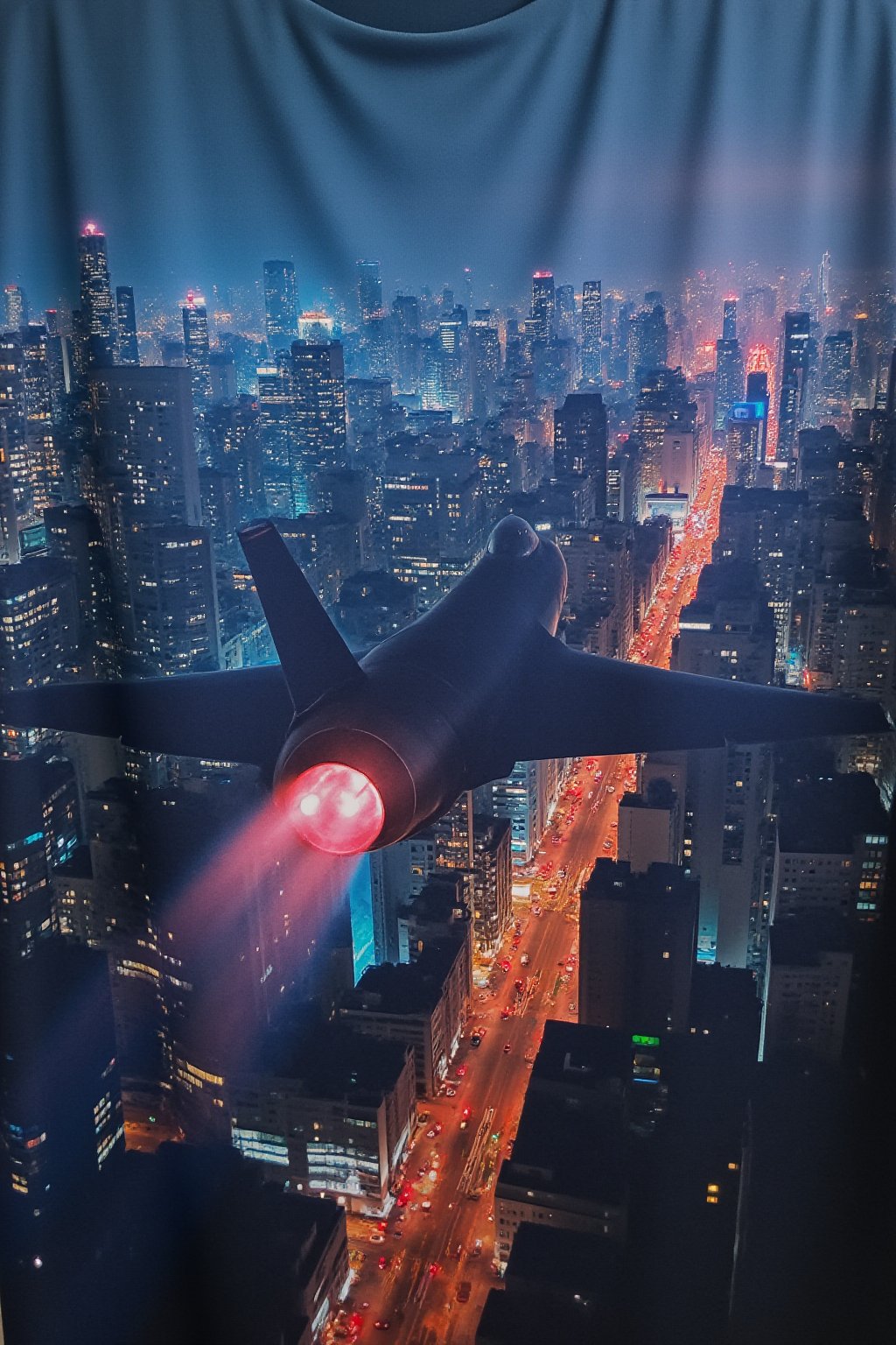 ,T_shirt,Design((best quality,ultra-detailed,realistic),fighter jet, flying over a city, at night, with vibrant city lights, atmospheric mood, cityscape, tall skyscrapers, glowing windows, illuminated streets, bustling traffic, dynamic motion blur, powerful engine exhaust, dramatic shadows, futuristic technology),looking_from_a_distance