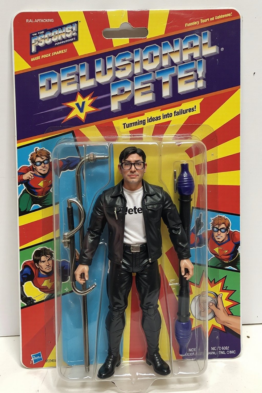 An unopened action figure package featuring "Delusional Pete" a superhero (psmoguel) who has the power to turn ideas on failures. The action figure stands proudly in the package, wearing glasses, wearing a black jacket and white shirt with the word "Pete" on his chest. The packaging is colorful and bold, with comic-style illustrations of "Delusional Pete" in action on the sides. The name "Delusional Pete" is written in big, bold, metallic letters at the top, with the tagline "Turning ideas into failures!" above. The background inside the package is a cityscape, reinforcing the superhero theme with a ral-afpacking logo at the top-left corner. 