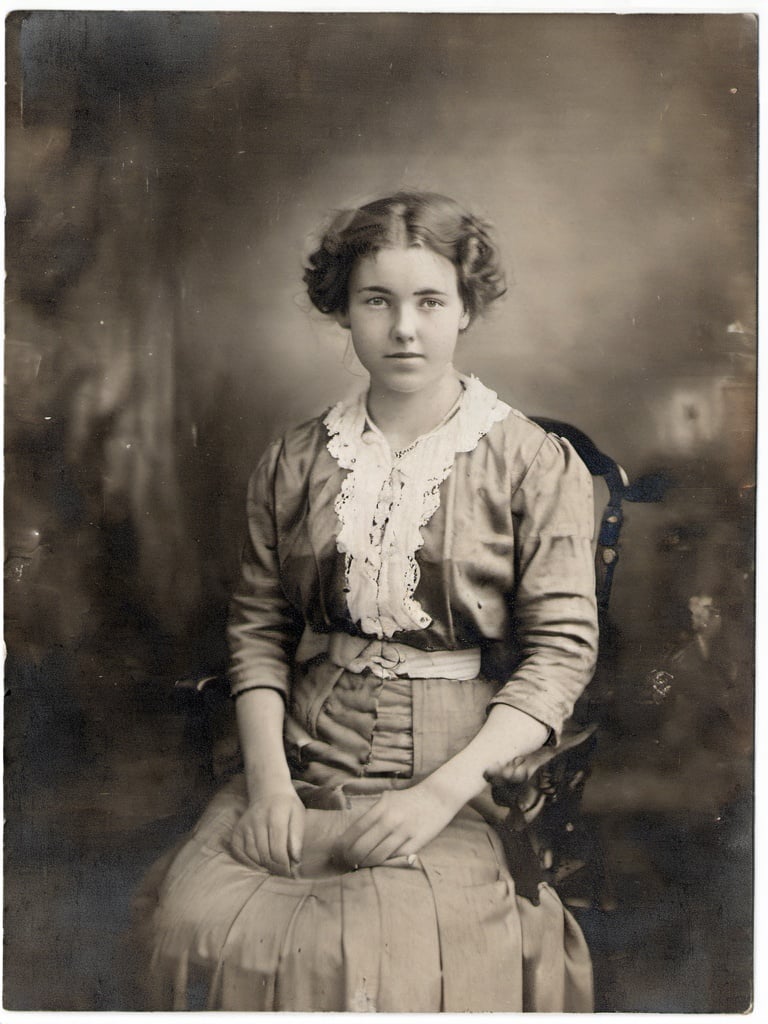 photograph of a cute young woman <lora:rppc:1>