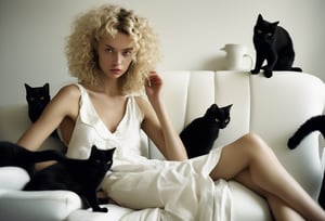 Photo of a blonde woman, perm wavy hair, white sundress, on sofa, surrounded by a group of black cats. Fine art photography, iconic, dynamic angle, dynamic pose, macro, photograph, sharp, focussed, Lomography Color 100, F/14, World-renowned, (designed by Olivier Valsecchi:1.2), beautiful detailed supreme quality color intricate, extremely stylish, deep aesthetic, sharp focus, magnificent, dynamic dramatic composition