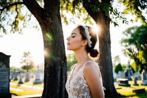 Photo.  Profile of a woman in a lace summer dress, She is looking upward with her eyes closed beside a tree.  Morning sun. Background is a cemetery