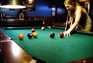 Closeup of a couple shooting pool at a local bar. Canon 5d Mark 4, Kodak Ektar, 35mm. 