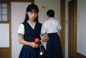  A cinematic film still of Yoko Minamino as Sukeban Deka, wearing dark blue Sailor Fuku long skirt, holding a toy yoyo in her hand, 80s Japanese Drama. Canon 5d Mark 4, Kodak Ektar, 35mm 