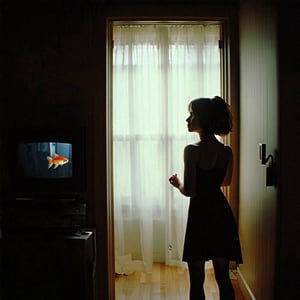 Film still. A midget watching TV. In the background, a woman in black minidress stands at the doorway, looking at the viewer. The TV featuring a program about goldfish. The atmosphere exudes a blend of mystery, intrigue, and dark comedy.