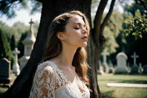 Photo.  Profile of a woman in a lace summer dress, She is looking upward with her eyes closed beside a tree.  Background is a cemetery. Style by J.C. Leyendecker. Canon 5d Mark 4, Kodak Ektar, 35mm
