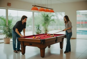 Photo of a couple playing at the pool table. Canon 5d Mark 4, Kodak Ektar, 35mm 