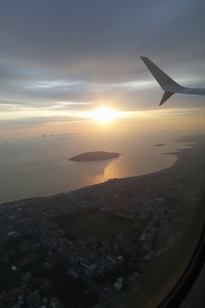 Rain, SHIU, female 63 years old Russia Woman 63 years old pilot on a Russian airplane airplane flying over the sea in the zenith of the sun