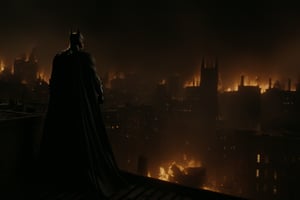 Movie Still of Batman on the rooftops of Gotham City with fires below