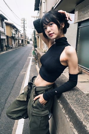 Cinematic Photo of a cute japanese girl,  (fit,  navel),  (muscular_abs:1.3),  short black hair,  bangs,  black sleeveless knitted turtle neck,  black knitted arm warmers,  green cargo pants,  black canvas belt,  black chunky boots,  leaning to a wall,  (bokeh:1.8)