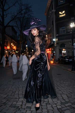 A high-quality anime-style illustration of a beautiful witch walking down a dark, empty street at night, followed by multiple transparent, ghostly spirits. She wears an elegant black and violet witch dress, complete with a pointed hat and flowing cape that catches the night breeze. Her expression is confident and calm, with a subtle, enchanting smile as she glances over her shoulder at the ghostly figures trailing behind her.

The spirits are faint and ethereal, with glowing eyes and soft, misty outlines that give them a haunting, otherworldly presence. The street is decorated with Halloween elements—flickering jack-o'-lanterns, shadowy trees, and dim street lamps casting eerie glows. Shadows dance across the cobblestone path, while moonlight and the faint glow of the spirits create a magical yet eerie atmosphere, perfectly blending the charm of the witch with the supernatural allure of Halloween night.
