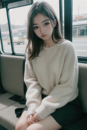 cute girl sitting on a bus, smirk, natural lighting from window, 35mm lens, soft and subtle lighting, girl centered in frame, shoot from eye level, incorporate cool and calming colors