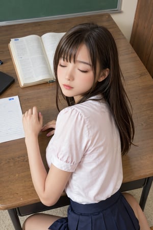 A girl sleeping on a desk with her chin in her hands