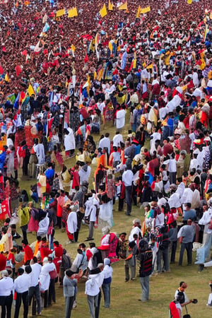 birds eye view of a procession, very large stone temple, hundreds of people in crowd,, tamil king with family on a chariot, people welcoming the king family, clear face