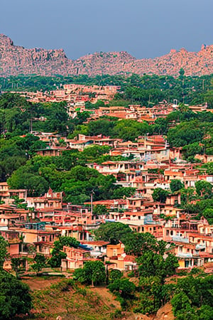 birds eye view of an ancient tamil village, year 1800AD, huge mountain on the background, crystal clear picture, dynamic lighting, view from above the palace