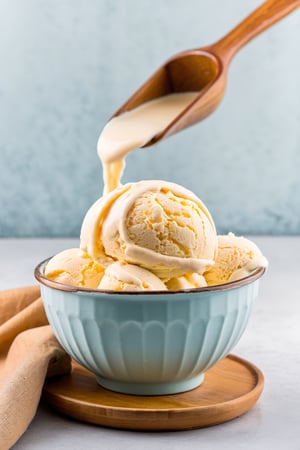 scoop of icecream with milk cover in the bowl