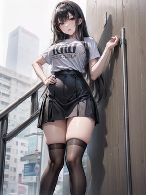 a young Asian woman stands to the camera. She is wearing a black and white striped t-shirt, a black skirt, and black stockings with black laces. Her long dark hair is cascading down her sholders, framing her face. She has a serious expression on her face, and her left hand is resting on her hip. The backdrop is a stark white wall, and a white pipe is visible in the top left corner of the frame.