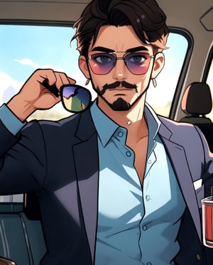 handsome white panamanian man with blue shirt, with sunglasses, black hear, very short van dyke beard on face 