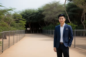 Handsome young Asian man wearing casualclothes, standing in a luxurious zoo.