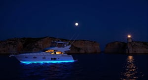 (((ultra photo REALISTIC))), sharp focus, extreme detail description, professional, vivid colors, bold color palette, photorealism, Captured at night, a medium-sized white yacht floats along a dark body of water. The yacht is adorned with a vibrant blue hue, adding a pop of color to the scene. The boat is positioned in front of a rocky cliff, with a lighthouse on the top of the cliff. The sky is a deep blue, and the moon is visible in the upper left corner of the image,   a true masterpiece of digital art. beautiful digital art, beautiful digital illustration, beautiful gorgeous digital art, gorgeous digital painting, cgsociety portrait, amazing digital art. In stunning 16K UHD resolution, this masterpiece showcases unparalleled quality, accuracy, and attention to detail, extremely high quality RAW photograph, detailed background, intricate, Exquisite details and textures, highly detailed, ultra detailed photograph, warm lighting, sharp focus, high resolution, Hyperrealism, masterpiece, accurate, super detail, best quality, award winning, highres, 16k 8k uhd, dslr, high quality,Enhanced all,hourglass body shape, ,background