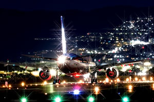 Masterpiece, high-resolution animation, ultra-high-resolution rendering, passenger plane landing on the runway at night, runway guide light, back of the passenger plane looking up from below,