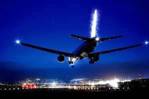 Masterpiece, high-resolution animation, ultra-high-resolution rendering, passenger plane landing on the runway at night, runway guide light, back of the passenger plane looking up from below,