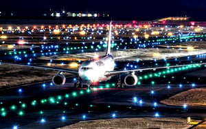 Masterpiece, high-resolution animation, ultra-high-resolution rendering, passenger plane landing on the runway at night, runway guide light, back of the passenger plane looking up from below,