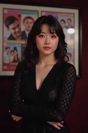  A young woman stands confidently against a movie poster backdrop, her gaze directed straight at the camera, exuding an air of confidence and allure, She wears a black top with a lace pattern, her features softly highlighted by even lighting, Off-center placement draws the viewer's eye towards her, while a subtle hint of a man in the background adds depth to the scene, The movie poster suggests a possible movie theater setting, 