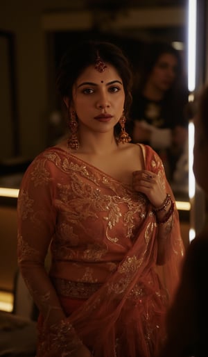 Cool cinematic lighting, matrix movie theam,A stunning Madona Sebastian, dressed in a rich red lehenga with intricate embroidery, paired with heavy gold jewelry and a resting on her hip and the other holding a delicate gold earring. The soft lighting highlights her natural complexion, while her eyes are enhanced by smoky eyeliner and volumizing mascara. She stands against a luxurious Bollywood-style backdrop, with subtle neon accents to emphasize her glamorous attire.,Madona Sebastian 