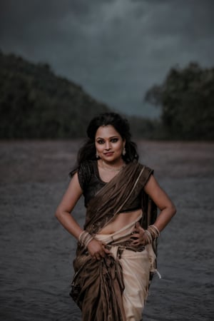 Prompt: A photorealistic portrait of an Indian woman in her late 20s with dark brown skin, long straight black hair, and sharp features. She is dressed in a sleek black saree with futuristic, tech-inspired accessories. Her eyes  giving her a mysterious, powerful look. The background is a dark, cyberpunk cityscape with green digital rain falling behind her, reminiscent of the Matrix. The lighting is low, with glowing neon lights reflecting off her leather outfit, enhancing the dramatic, action-movie atmosphere.,