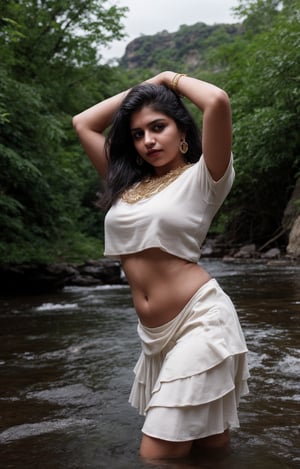 Beautiful curvy women, solo, long hair, skirt, shirt, black hair, jewelry, standing, full body, earrings, midriff, water, blurry, arms up, bracelet, tree, blouse, , blurry background, white skirt, red shirt, long skirt, rock, photo background, Indian traditional dress , 28yo, plumb , not slim,  The task is to annotate the image by identifying and describing its content using natural language. The image contains a woman standing in a natural setting, which includes a stream and rocks. She is dressed in traditional attire with a red blouse and a white skirt, adorned with gold detailing. Her pose and the serene environment suggest a connection with nature and possibly a cultural or personal significance to the attire and setting.