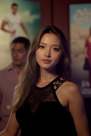  A young woman stands confidently against a movie poster backdrop, her gaze directed straight at the camera, exuding an air of confidence and allure, She wears a black top with a lace pattern, her features softly highlighted by even lighting, Off-center placement draws the viewer's eye towards her, while a subtle hint of a man in the background adds depth to the scene, The movie poster suggests a possible movie theater setting, 